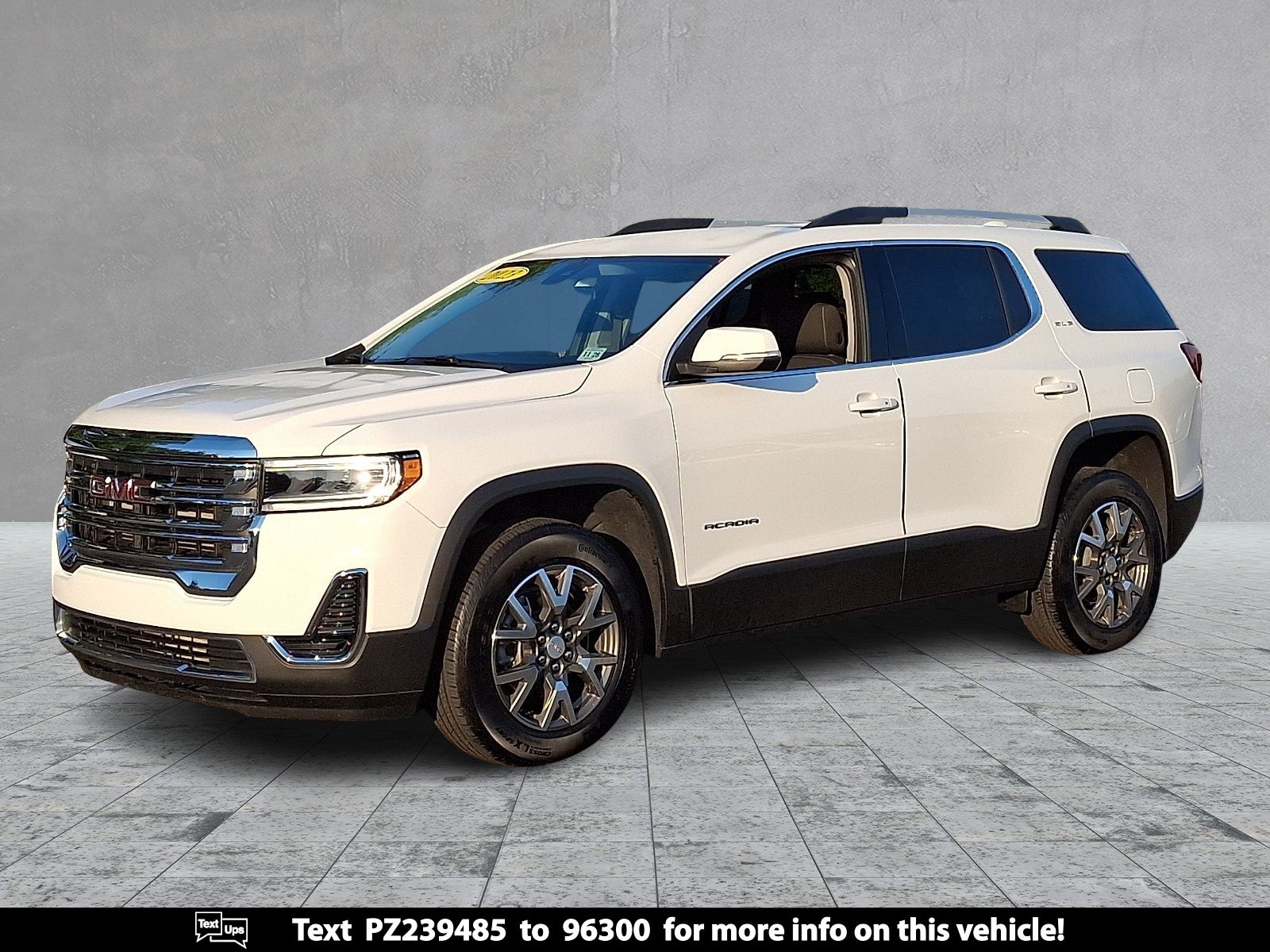 2023 GMC Acadia SLE in Summit White — front three-quarter view