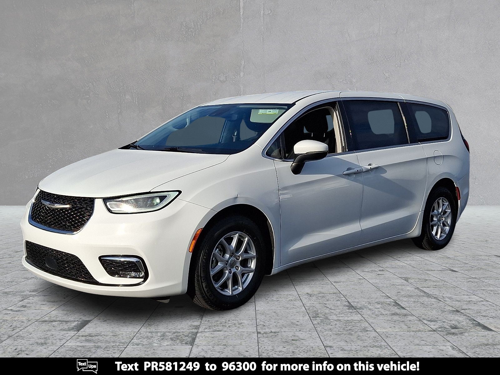 2023 Chrysler Pacifica Touring L in White — front three-quarter view