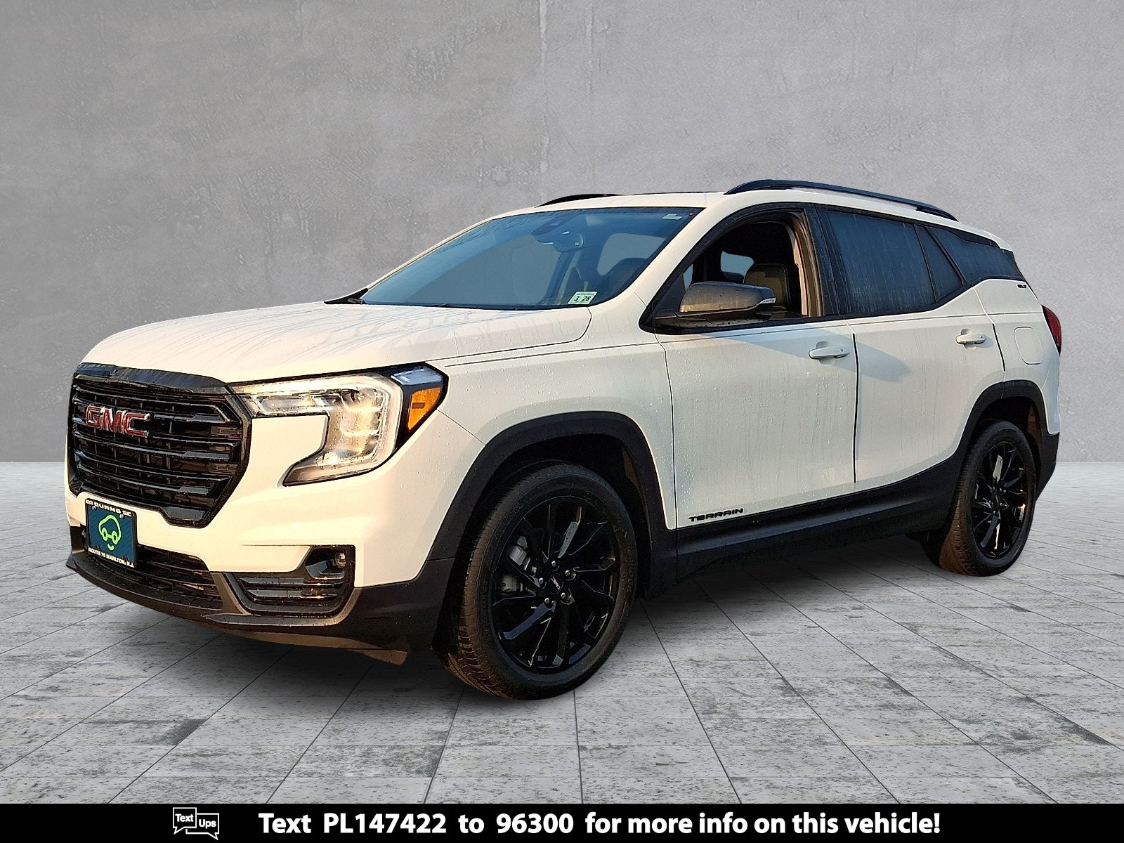 2023 GMC Terrain SLT in Summit White — front three-quarter view