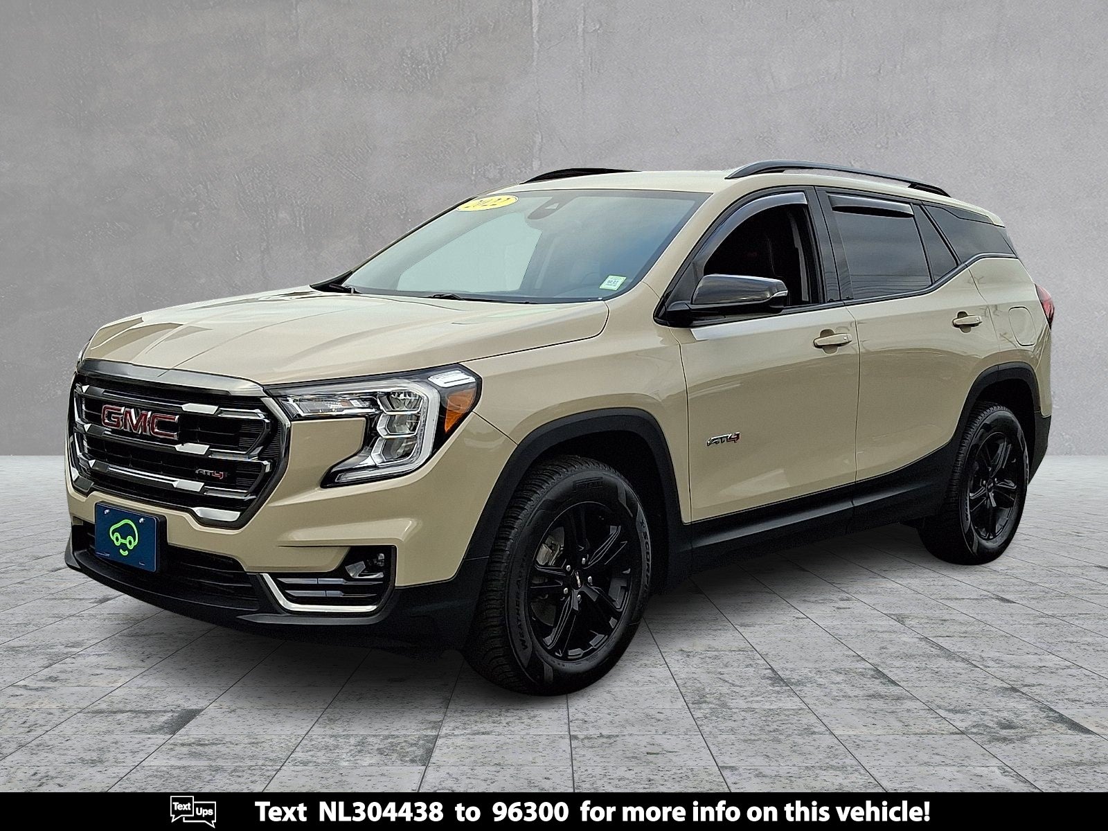 2022 GMC Terrain AT4 in Desert Sand Metallic — front three-quarter view
