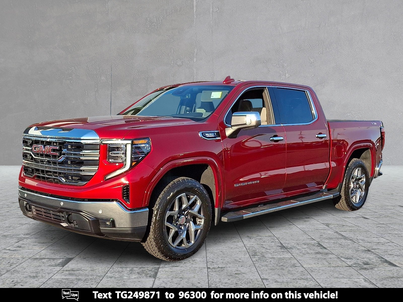 2026 GMC Sierra 1500 SLT in Volcanic Red Tintcoat — front three-quarter view